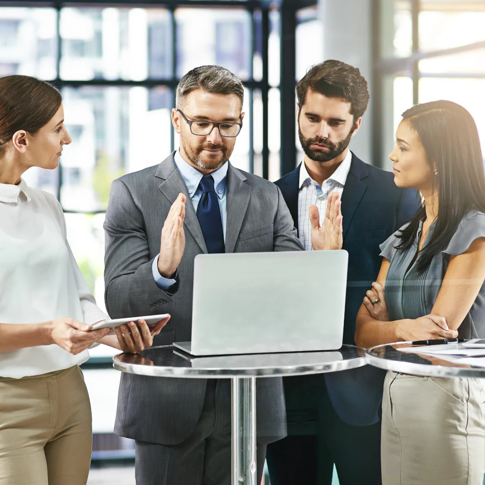 Business team reviewing company registration documents in a modern office