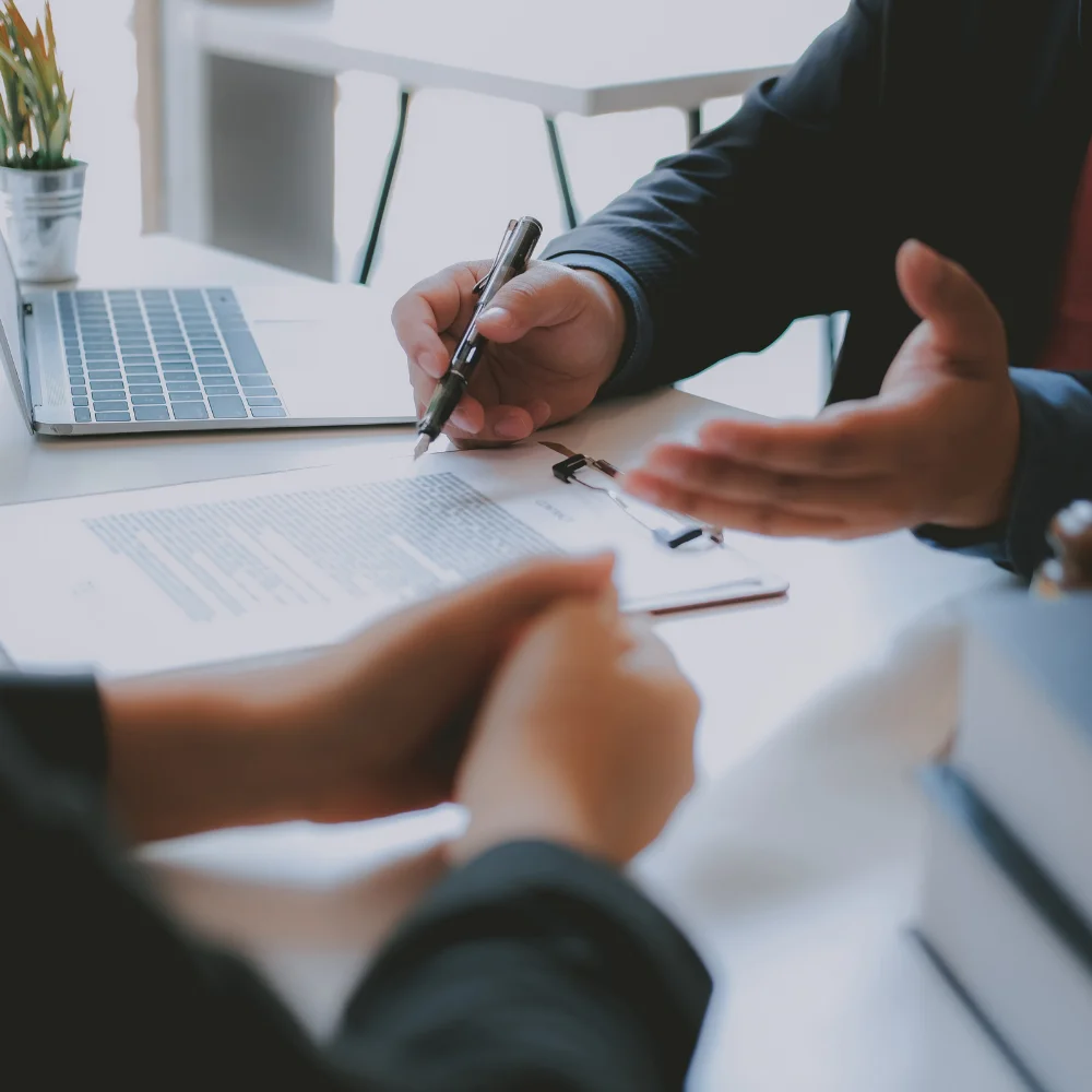 Business team reviewing company documents in a modern office