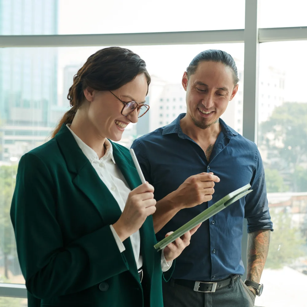 Business team reviewing company registration documents in a modern office