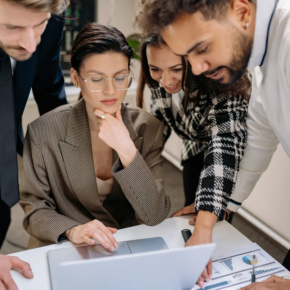 Business team reviewing company documents in a modern office