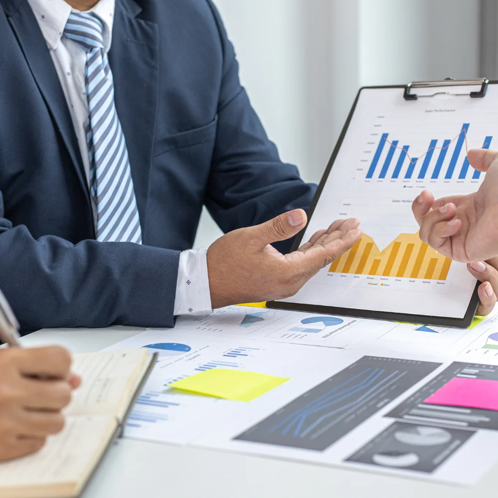 Business team reviewing company documents in a modern office