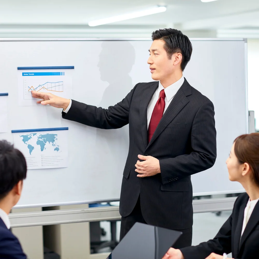 Business team reviewing company registration documents in a modern office