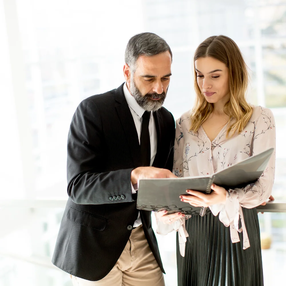 Business team reviewing company documents in a modern office