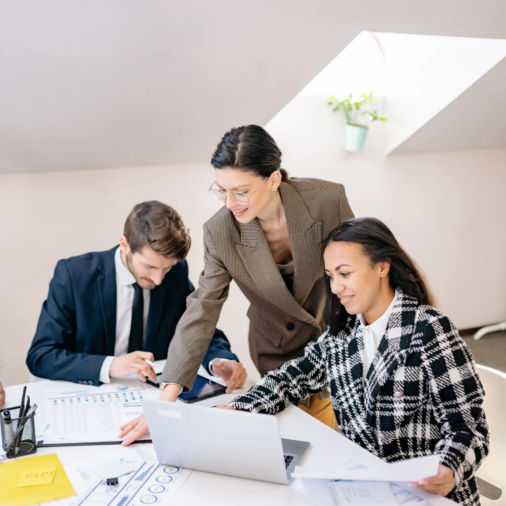 Business team reviewing company documents in a modern office