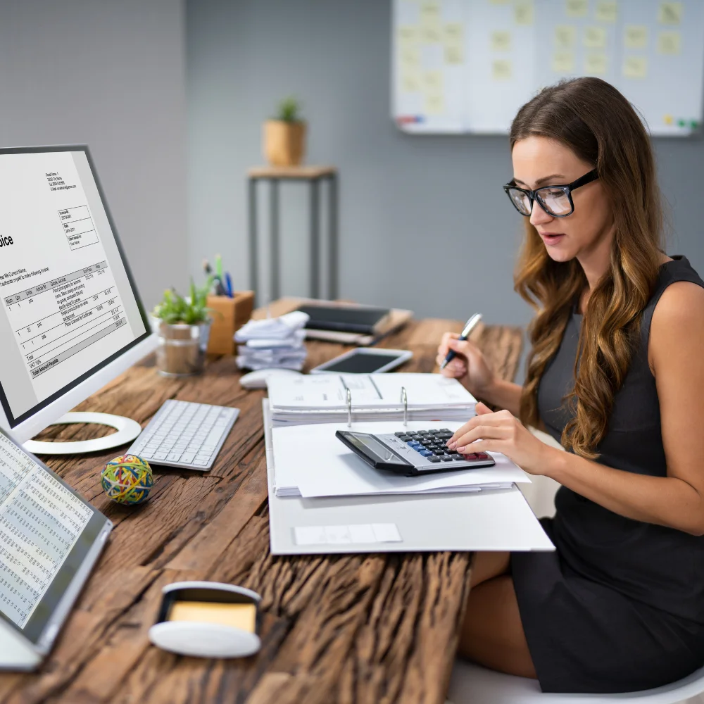 Business team reviewing company registration documents in a modern office
