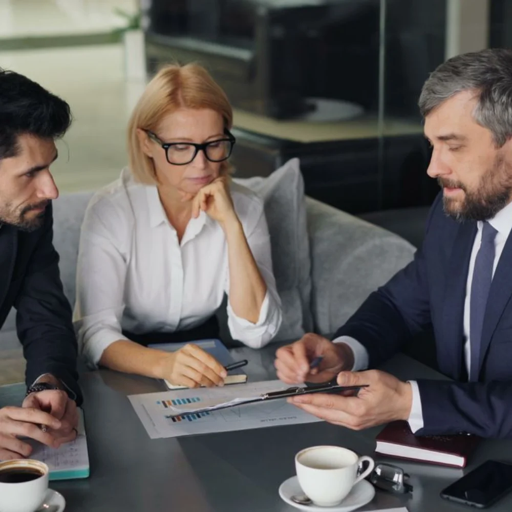 Business team reviewing company documents in a modern office