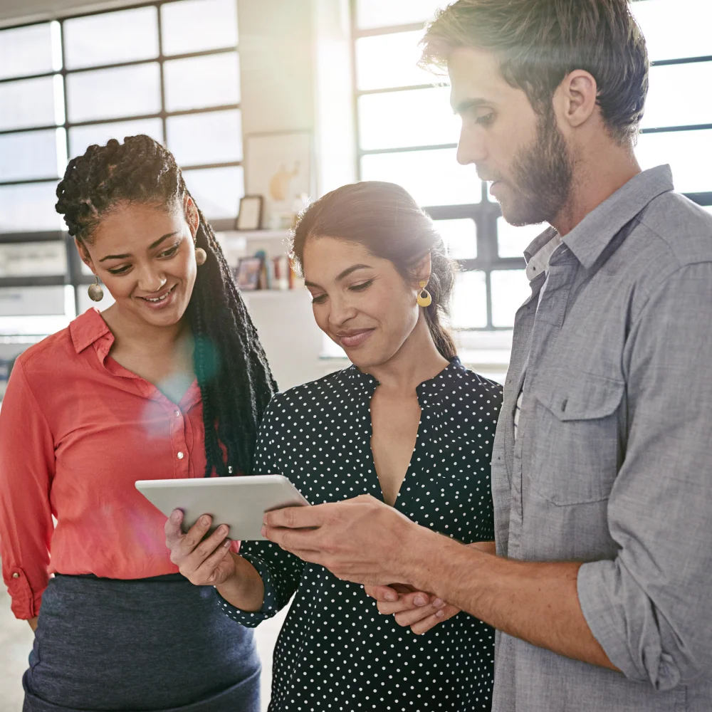 Business team reviewing company documents in a modern office