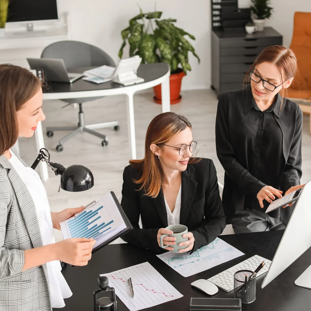Business team reviewing company documents in a modern office